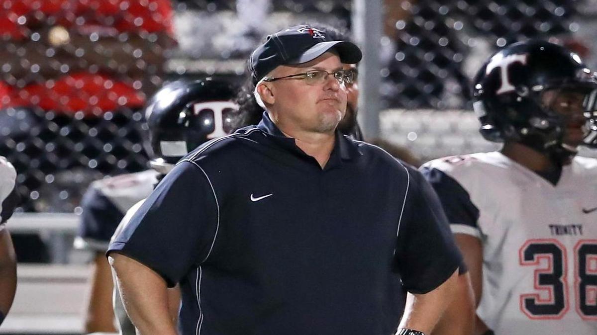Trinity coach Chris Jensen watches late in his team’s 42-28 loss to Southlake Carroll.