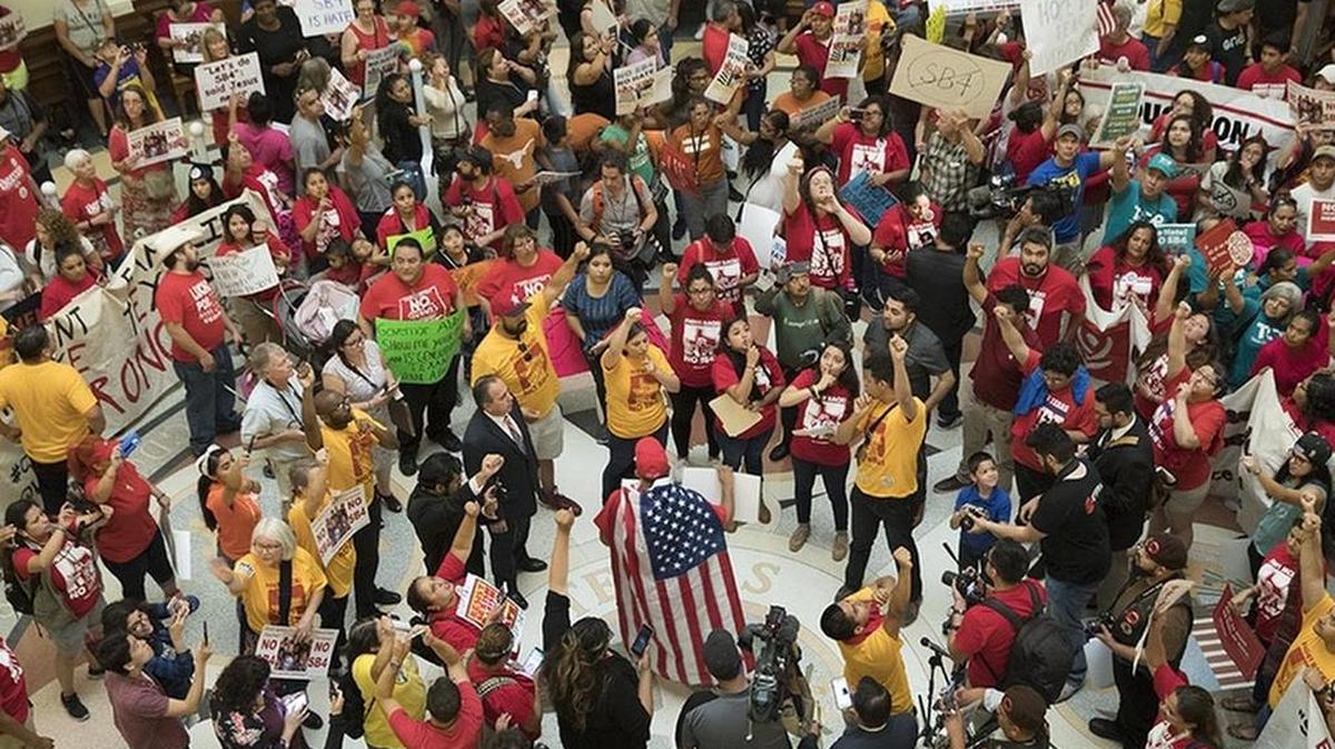An anti-sanctuary cities protest engulfs the Capitol rotunda on the last day of the regular session May 29. The American Immigration Lawyers Association is relocating its 2018 convention from Texas to another state because of the state’s new immigration law. About 3,000 people were expected to attend the event in Grapevine.