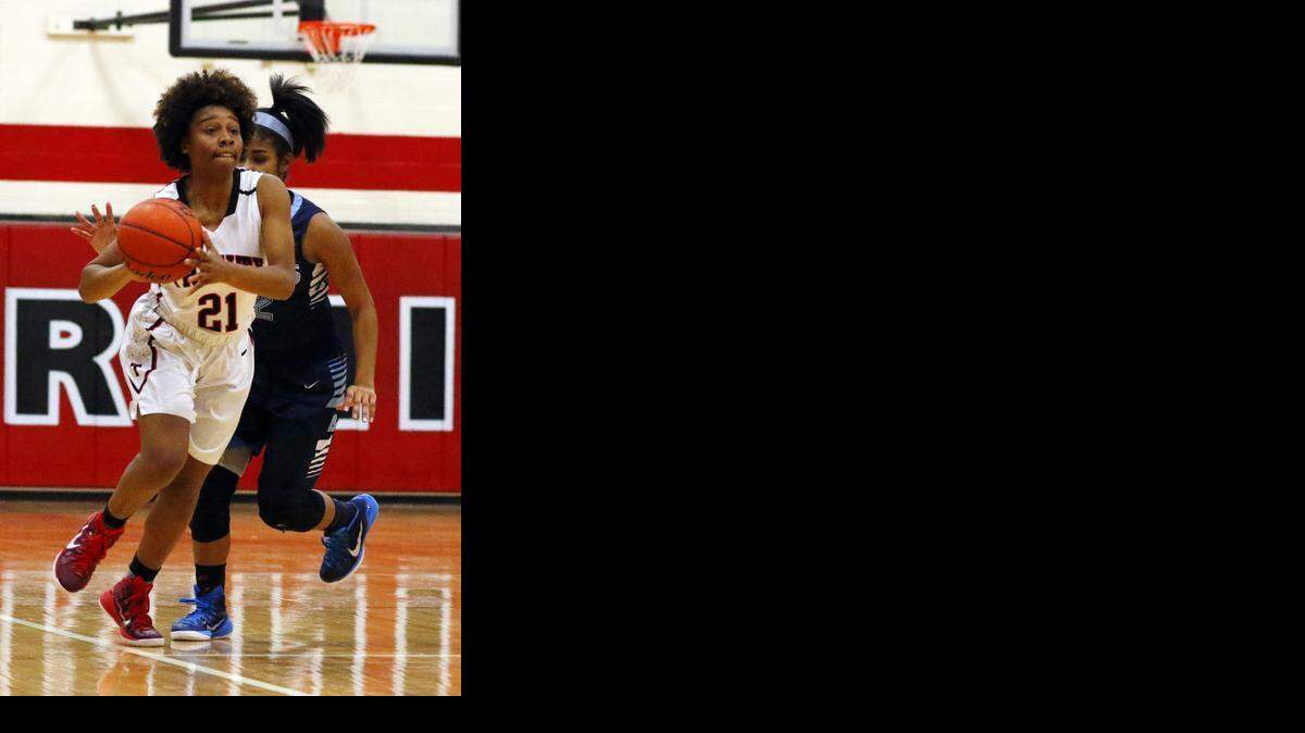 
Trinity’s Haleigh Talbert (21) passes the ball against L.D. Bell in a January game. Coach Sue Cannon said Talbert did a great job at point guard as a sophomore.

