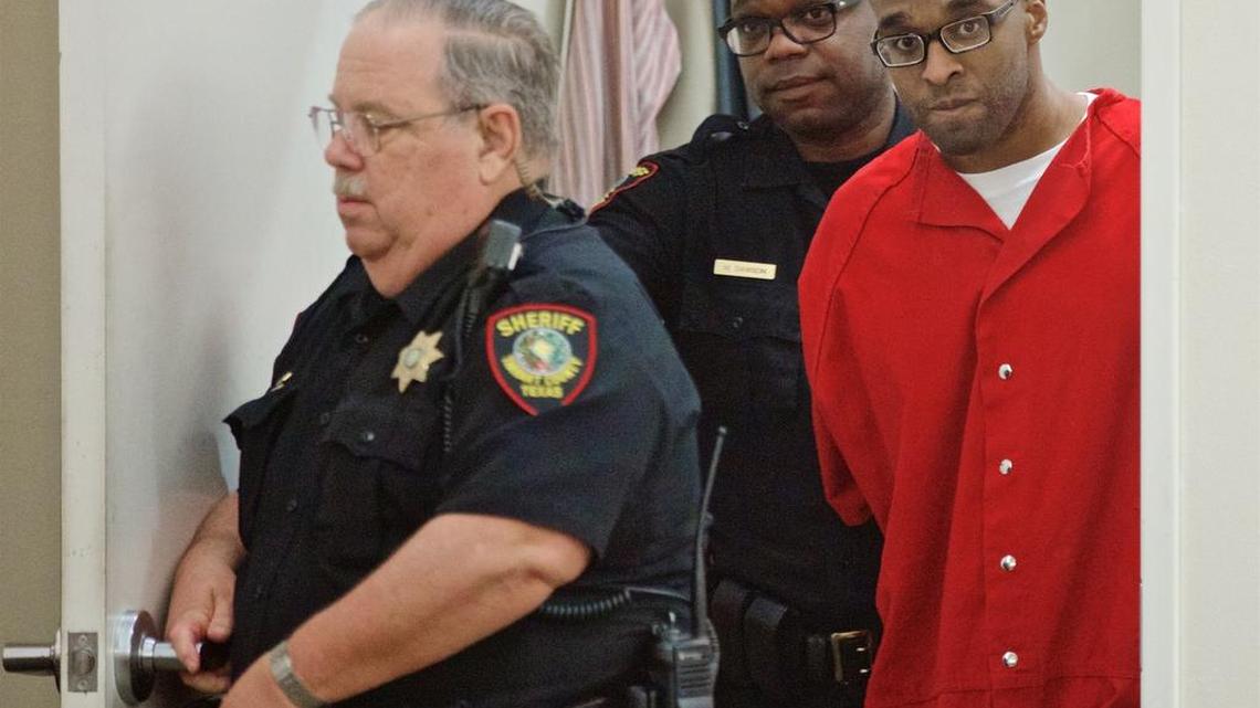 Paul Storey, right, is led into state District Judge Robb Catalano’s court for a recent hearing in Fort Worth. Storey was convicted of capital murder in 2008 for the shooting death of Jonas Cherry.