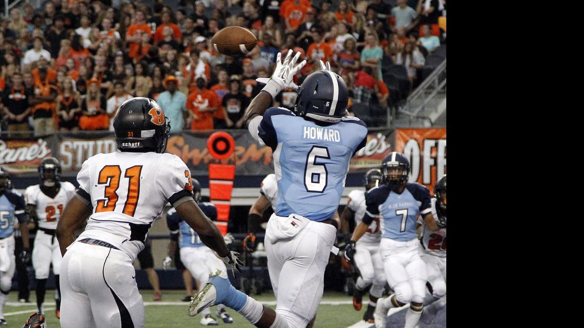
Bell wide receiver Tacorian Howard catches a pass for a touchdown against Rockwall last season.
