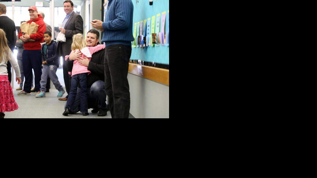 
Brody Lipperman receives a hug from his daughter, Ellie,5, just before they enter the cafeteria for Rockenbaugh Elementary School's annual Dad's Invasion Luncheon, held Thursday, January 15, 2015 in Southlake,TX. During the event, the school welcomes dads to have lunch with their children in grades pre-k through 4th grade.
