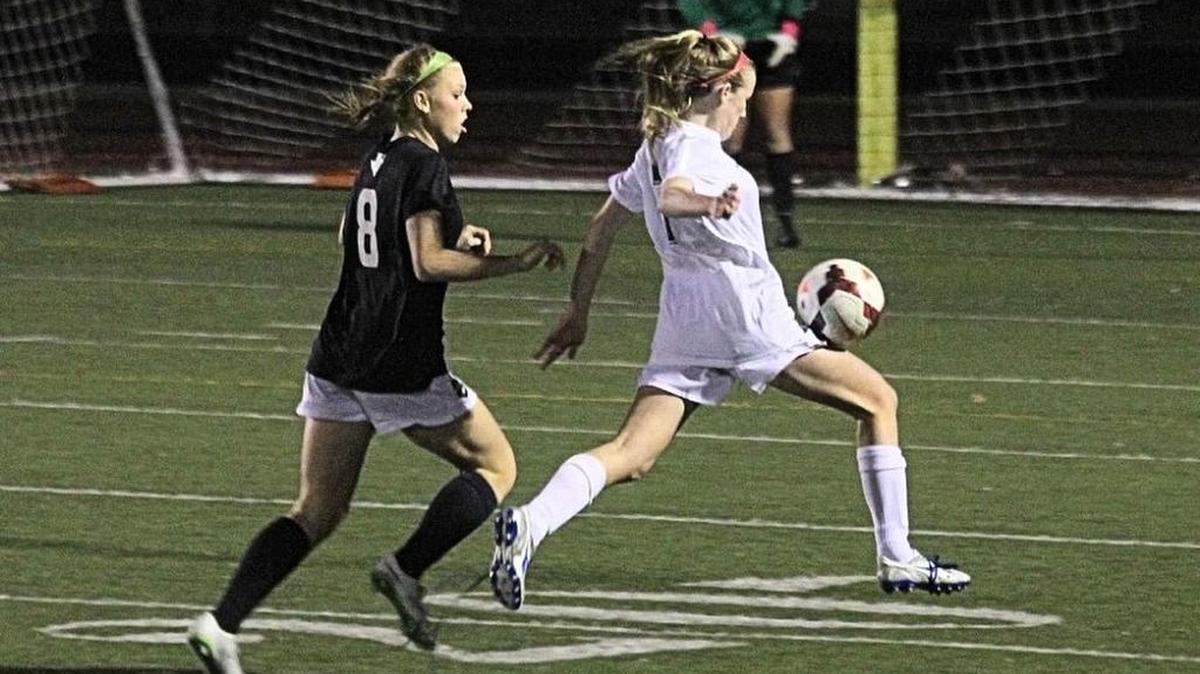 Heritage’s Allie Lumpkin (right) was voted offensive player of the year by her teammates last season.