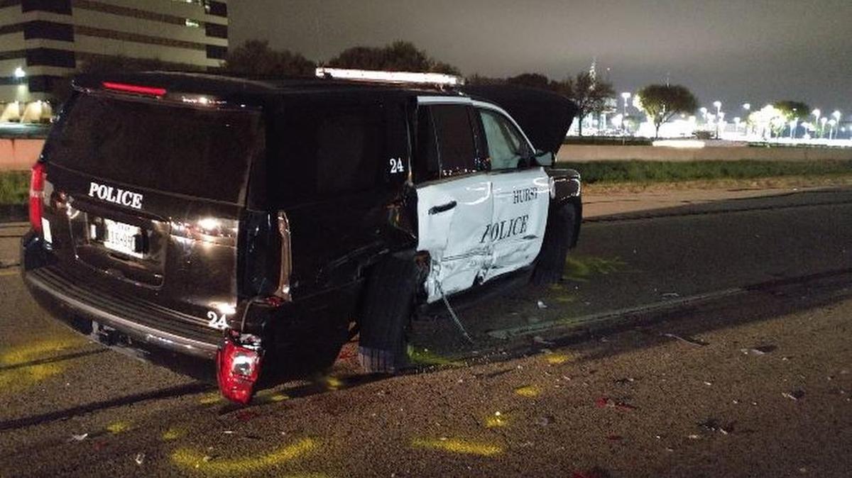 A Hurst officer was injured overnight when a suspected drunken driver crashed into his parked patrol SUV.