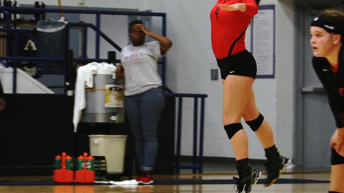 
Margaret Dean serves for the Lady Trojans last season.
