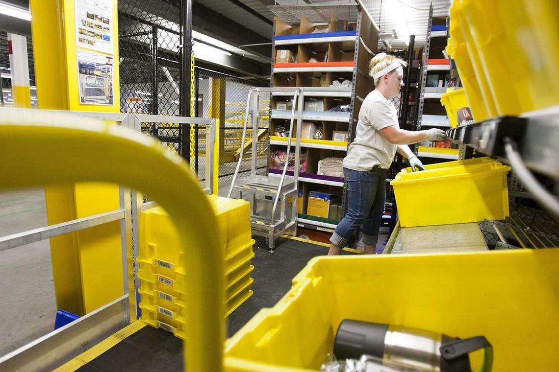 A worker stores items in the pick pods in 2015 at Amazon's Fulfillment Center in Haslet. The online retailer is looking for a place to build a second headquarters, and North Texas cities are lining up to be considered.