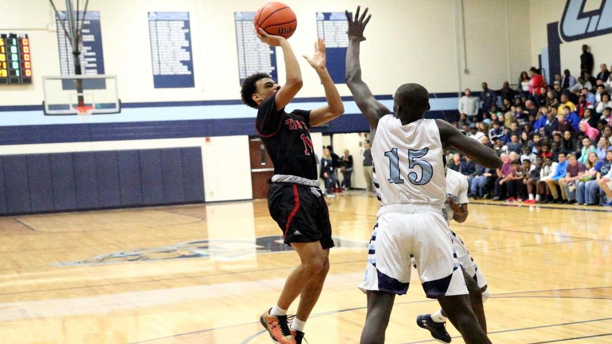 Jhivvan Jackson shoots against L.D. Bell last season. The senior has set a goal of winning a playoff game this season.