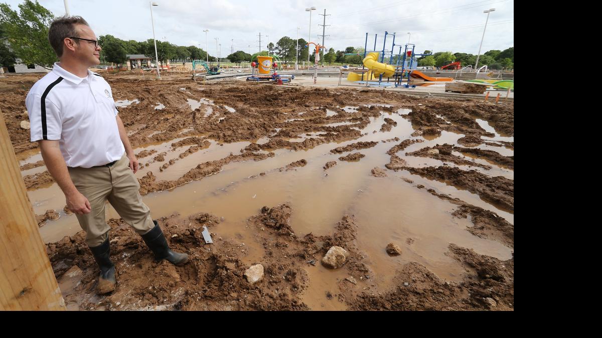 
Hurst construction engineer Eric Starnes was hoping that the new Chisholm Aquatics Center would open in June, but the construction site was a sea of mud and standing water Friday from recent rains. The constant rains have put construction on hold. 

