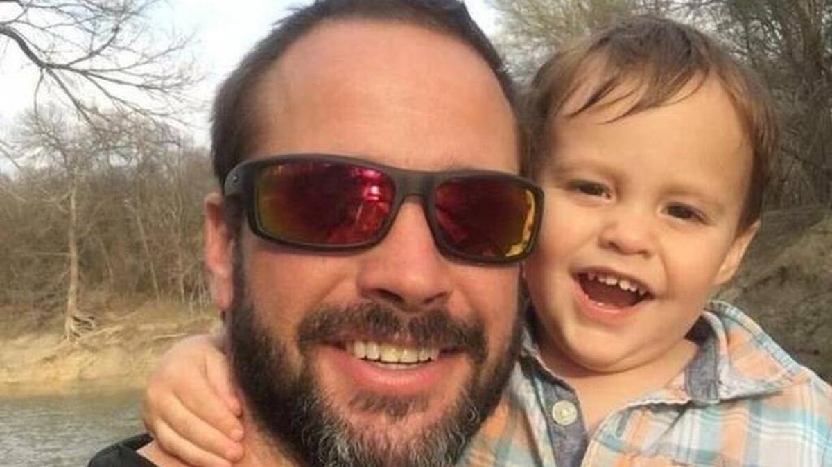 Matthew Meinert, 38, with his 2-year-old son, Oliver, shortly before their fishing trip Monday.