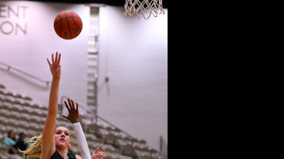 
Carroll’s Anna Hurlburt (30) shoots over a South Grand Prairie player last season.

