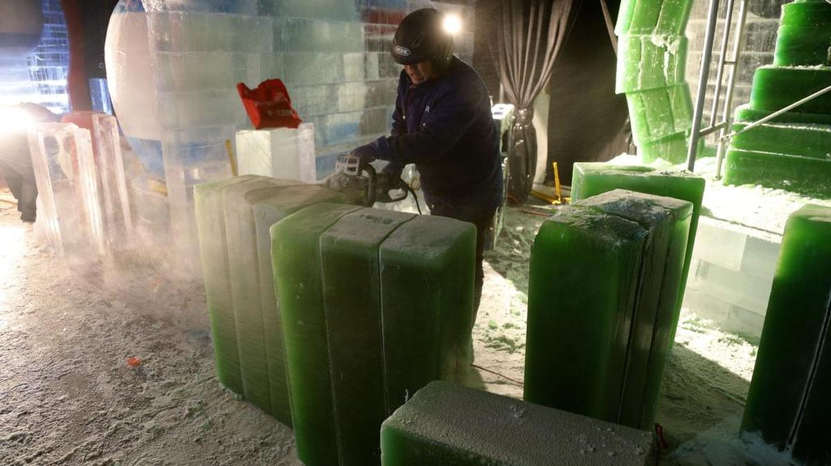 Zhiming Zhang uses a chain saw as artisans from Harbin, China carve two million pounds of ice in a nine degree deep freeze to prepare the ICE! at Gaylord Texan, Christmas Around the World show, Friday, October 23, 2015. The 12th annual Christmas events runs from November 12 to January 3.