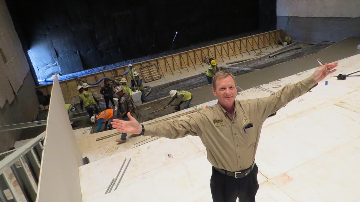General Manager Terry Sullivan stands on one of the upper tiers in what will be a more than 200 seat theater when the new Movie Tavern-Shops at Central Park in Bedford opens early next year.