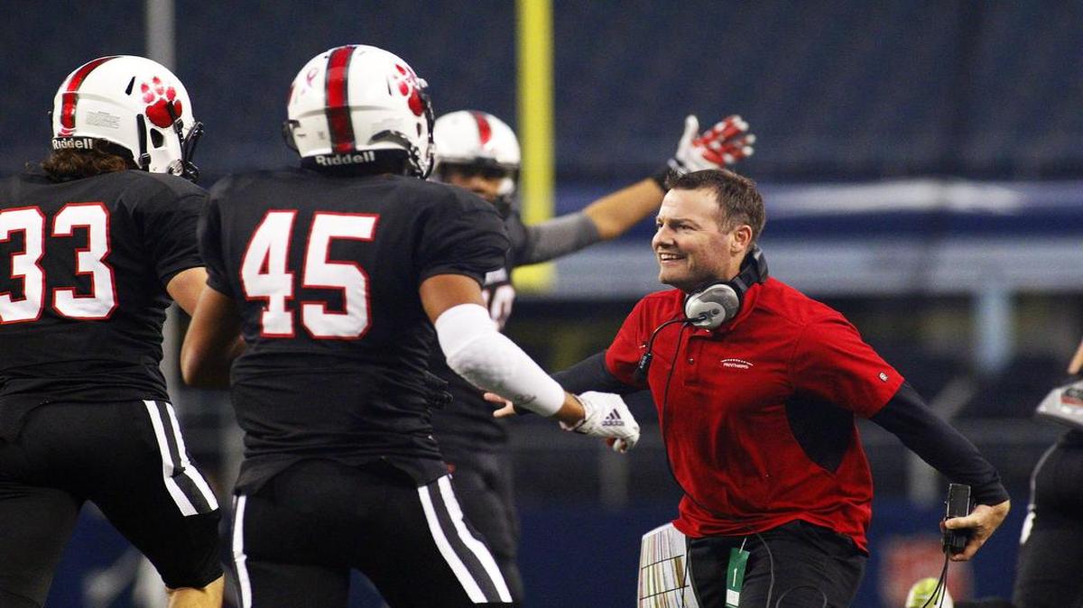 Judd Thrash greets Heritage players in 2014. He’s expected to be approved as the new head coach for McGregor, near Waco.