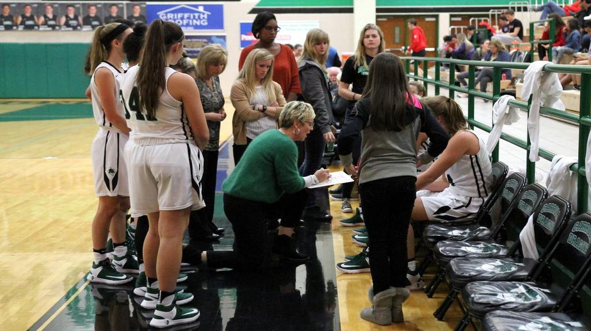 Carroll girls basketball coach Teri Morrison, center, is working to keep confidence high on her struggling team.
