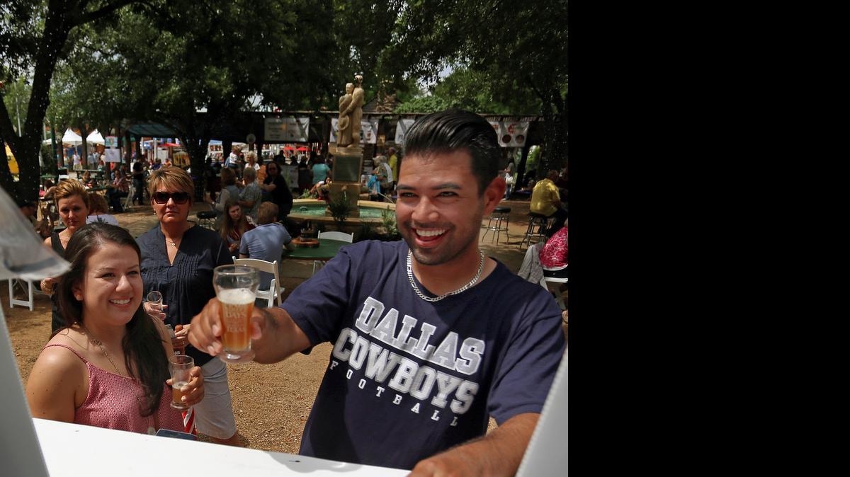 
Landon Esquivel and Jessica Aillon, both of Grapevine, sample beer. 

