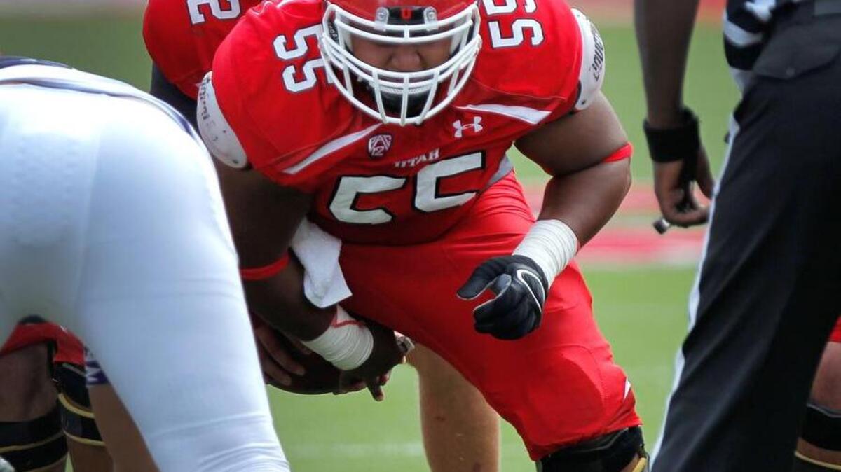 
Trinity graduate Hiva Lutui (55) snaps the ball for the University of Utah.
