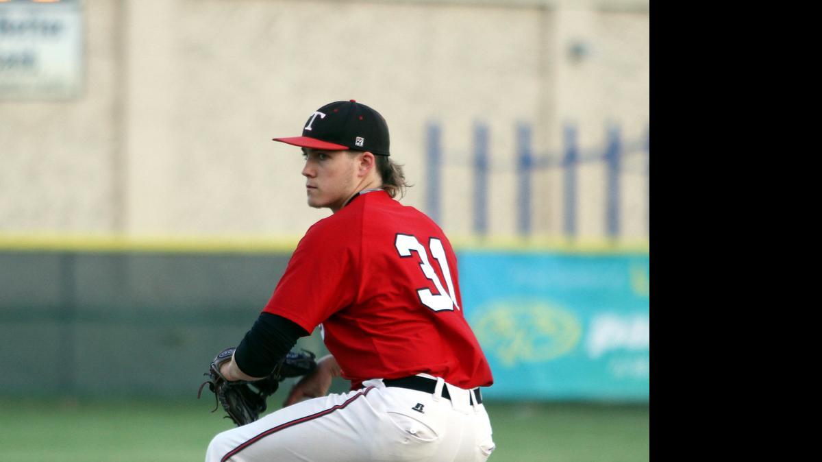 
Trinity senior pitcher Drew Johnson learned to throw and bat left-handed at age 15 to work around an injury, but went back to throwing right-handed.
