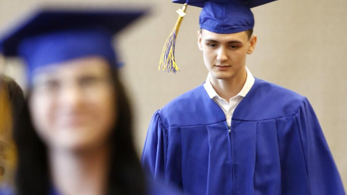 Caleb Vasquez walks to his seat with fellow students during Bridges Accelerated Learning Center 2017 Commencement at Colleyville Center Tuesday May 23, 2017.