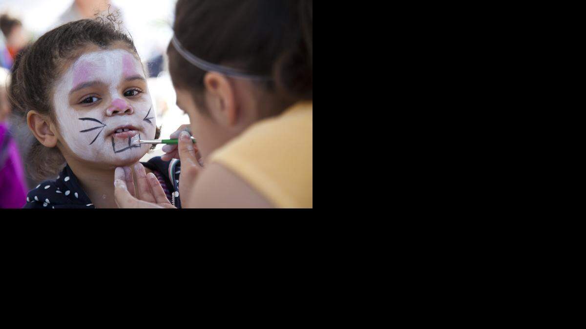 
Alana Cooper gets her face painted. 

