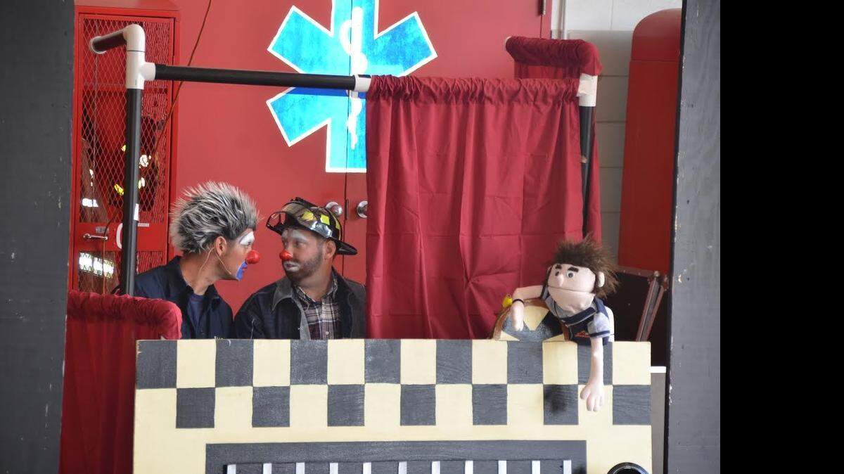 
Members of the FALSE Alarm gang of the Bedford Fire Department always have a laugh as they teach fire prevention. Firefighter/paramedic Alex Hardy, aka Blaze, left, and firefighter/paramedic Matt Wagner, aka Hazmatt, put on a performance last year for Bedford students along with Uncle Fried, the puppet. The gang will return this fall to Bedford schools.
