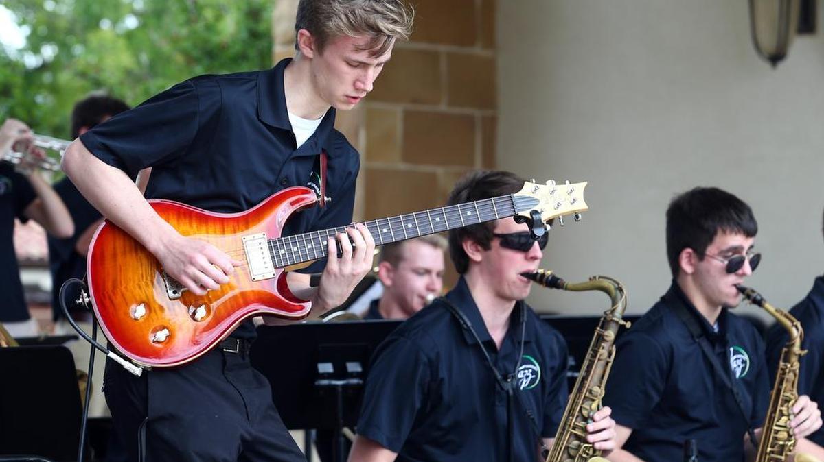 Ethan Ditthart performs on the guitar with the Carroll High School Jazz Band.
