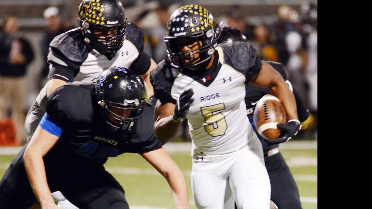 
Byron Nelson’s Kellen Diesch, left, tries to tackle Keller Fossil Ridge's Keshawn Mitchell in a district match last season.
