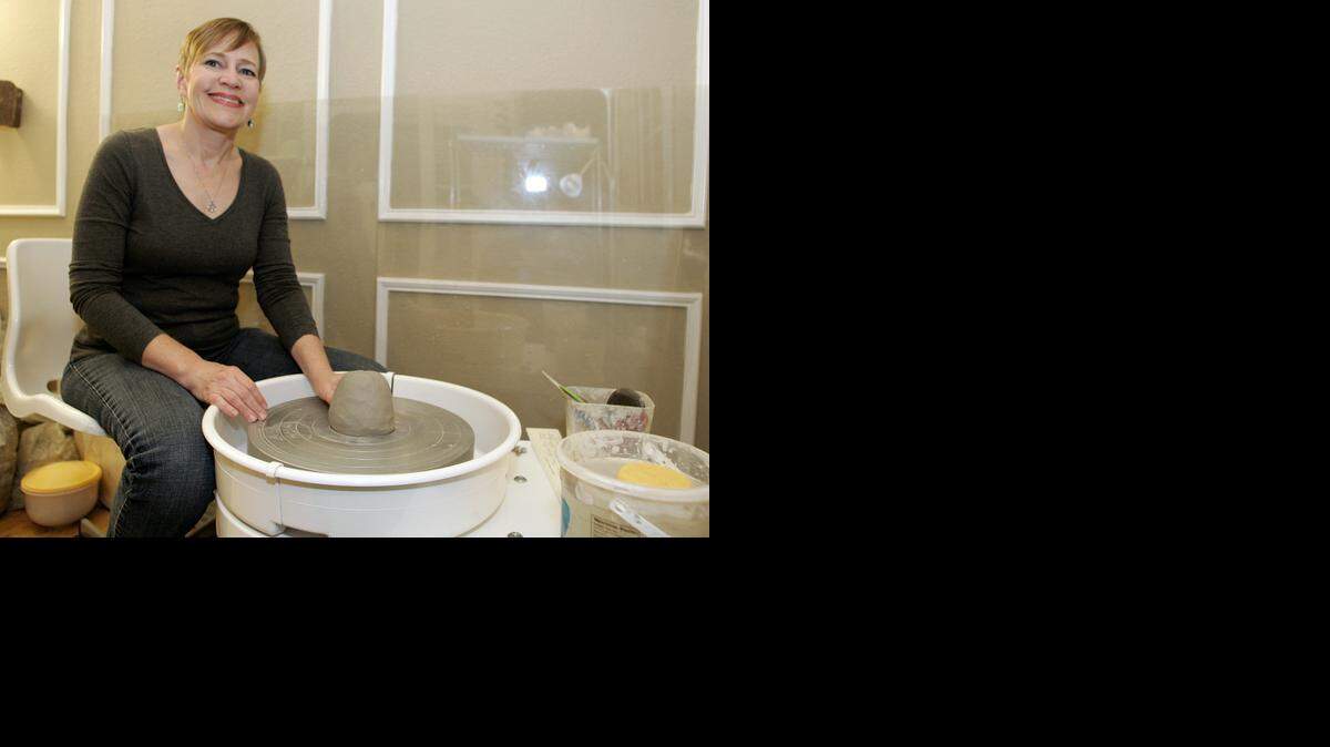 
Karen Ahaus with her potters wheel in her home studio. 
