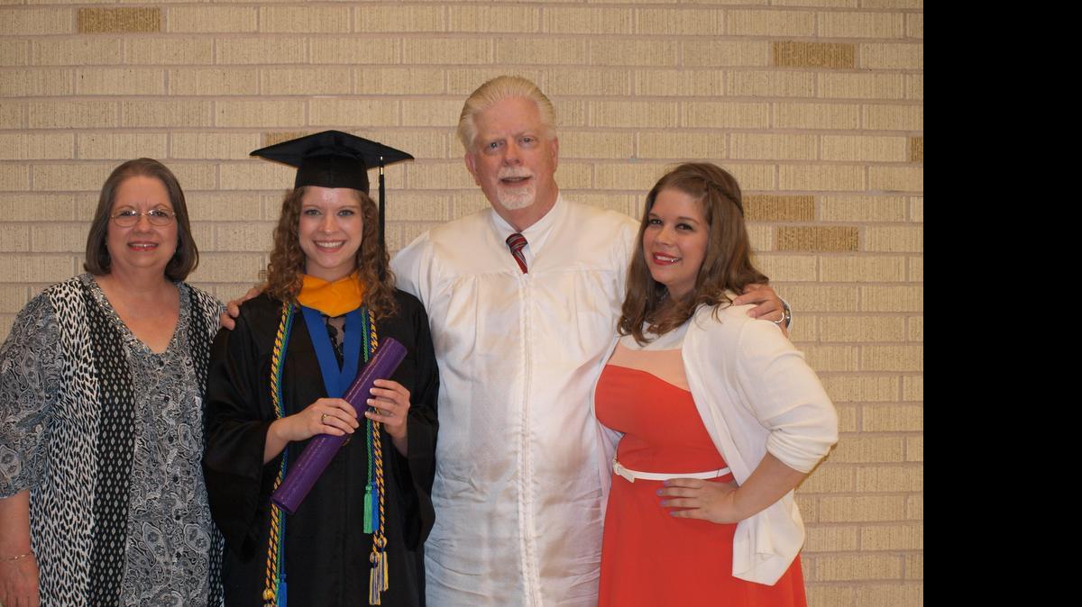 
Linsey Thut smiles for a photo with her mom, Kim, dad, Richard, and sister, Chelsea, after her graduation ceremony at Abilene Christian University May 9.
