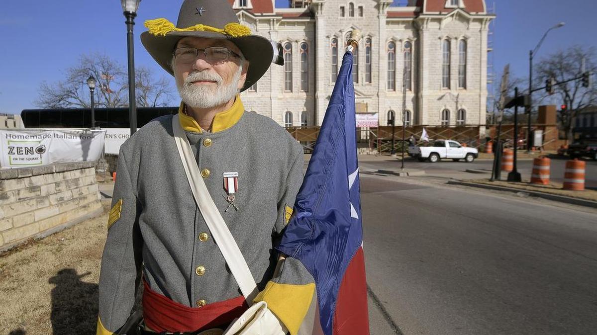 Daniel Nation of Fort Worth is part of Sons of Confederate Veterans gathering at the Parker County Courthouse to celebrate Confederate Heroes Day in Texas, a state holiday in Weatherford, TX, Friday, Jan. 19, 2018.