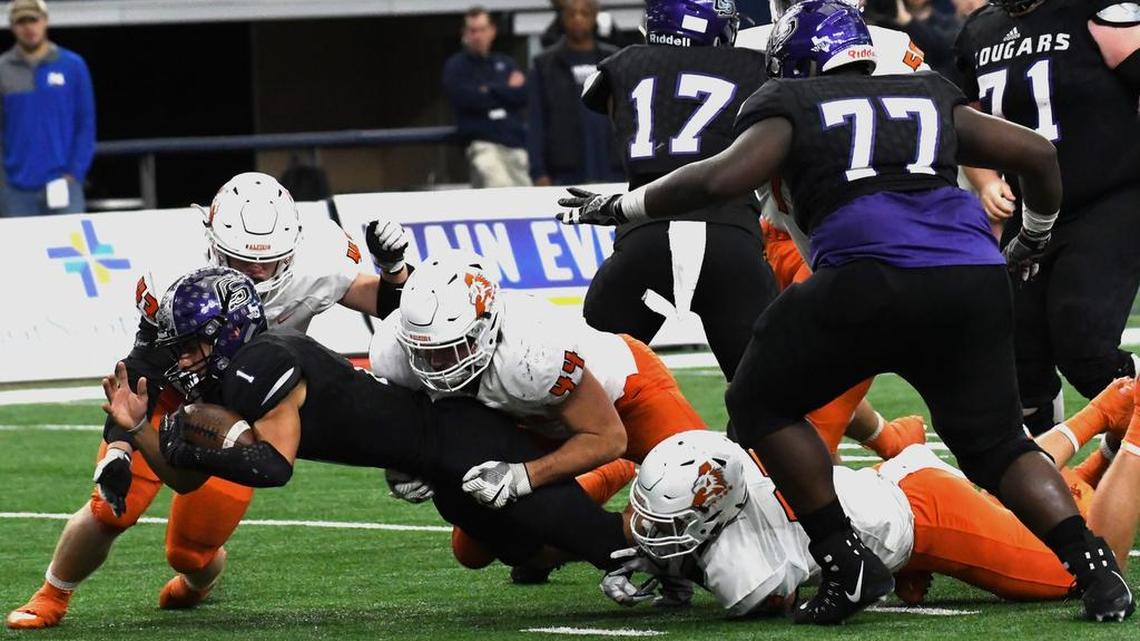 Aledo’s Colt Ellison (44) keep College Station’s quarterback Marquez Perez (1) from getting into the end zone during Saturday’s UIL State Championship final at AT&T Stadium in Arlington.