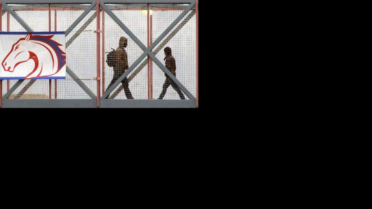 
Students use a pedestrian bridge to cross Cooper Street at University of Texas at Arlington, Friday, February 15 2013. 

