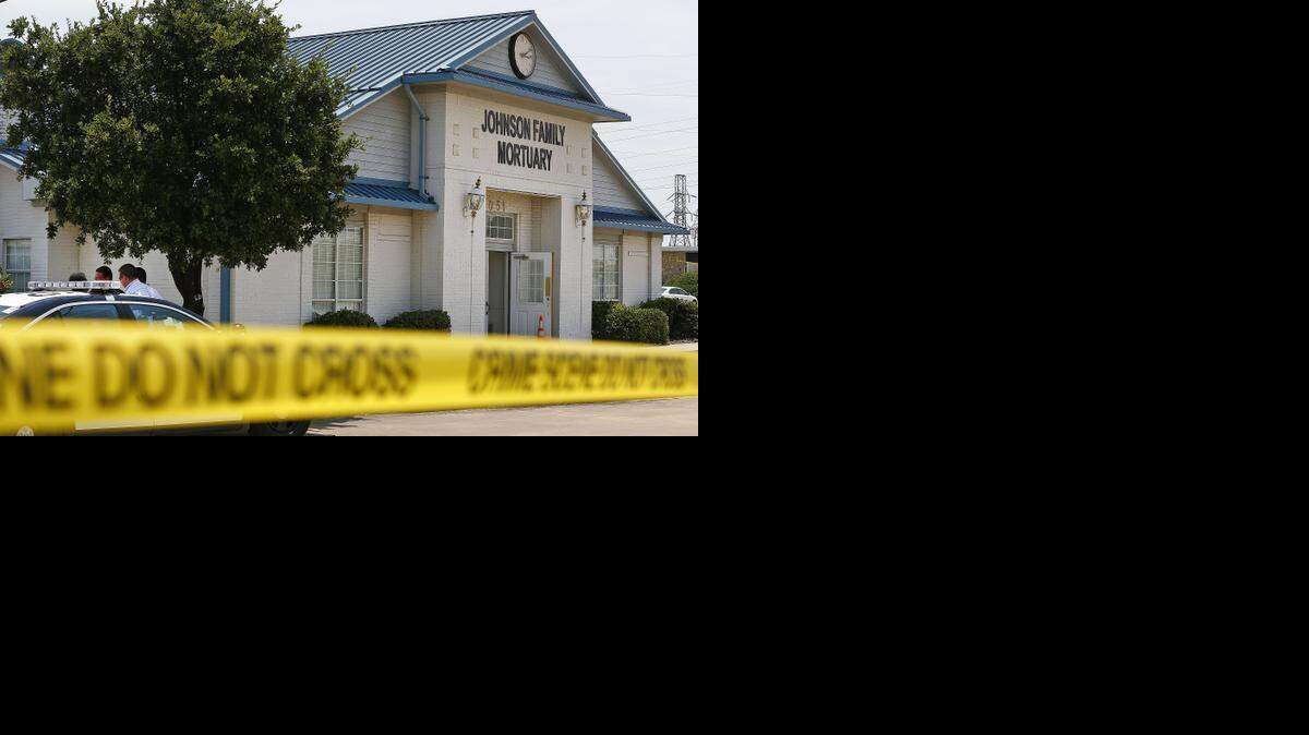 
Fort Worth police at the Johnson Family Mortuary where the owners were evicted and multiple bodies were left behind and found July 15. The owners have been indicted on charges of failing to provide funeral services for several families.
