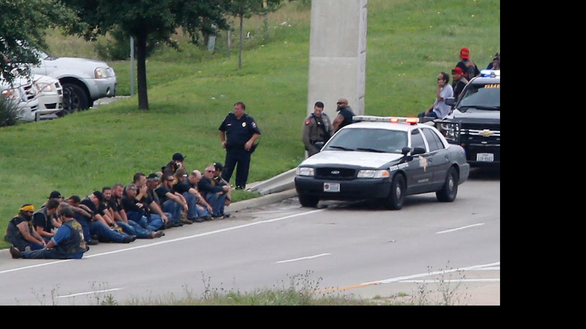 
Authorities block an access road as an investigation continues near a Twin Peaks restaurant Sunday in Waco, where nine people were reportedly killed in a biker shootout.
