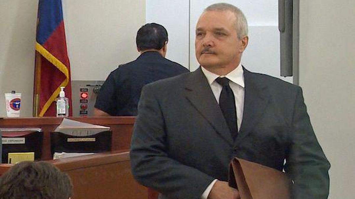 
John St. Angelo stands in court Monday where he is on trial in the killing of his former wife Suzanne Parsons.
