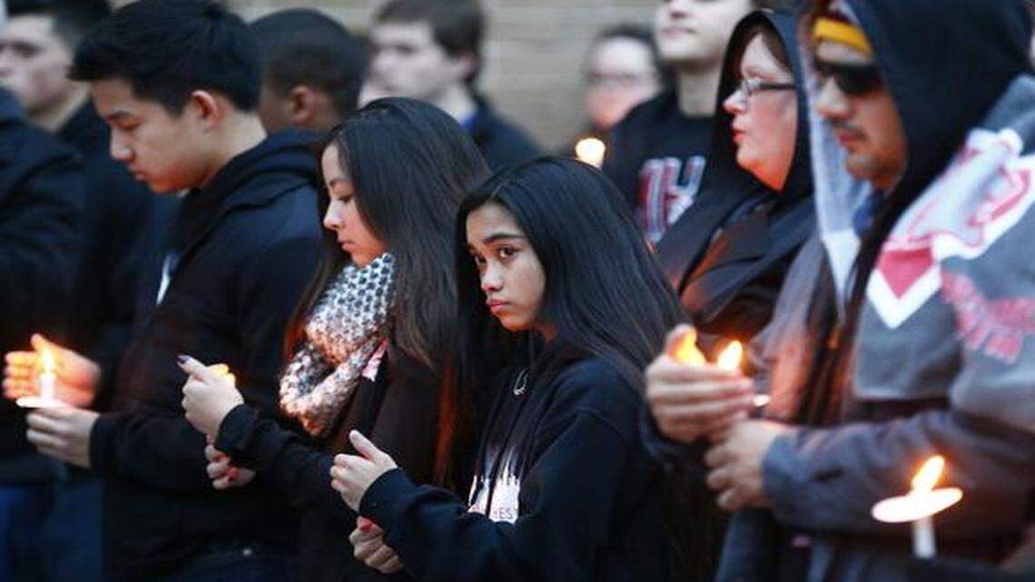 
Students and teachers at a candlelight vigil for Arlington Martin High School student Carl Wilson who was killed Monday in Kennedale. The vigil was at the school Tuesday, Jan. 13, 2015.
