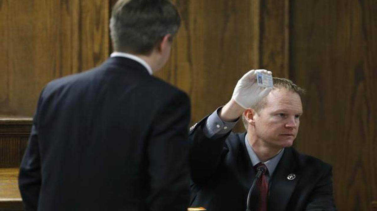 
Texas Ranger Danny Briley holds up an identification card found in Eddie Routh’s wallet on Monday, Feb. 16, 2015. Briley testified about interviewing Routh hours after in Chris Kyle and Chad Littlefield were found dead at a shooting range near Glen Rose.
