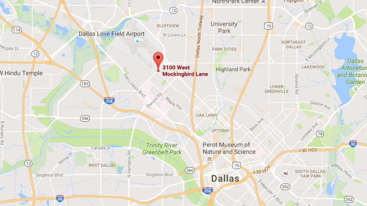 Police found an unidentified woman shot dead in a running car after midnight Tuesday near Love Field.
