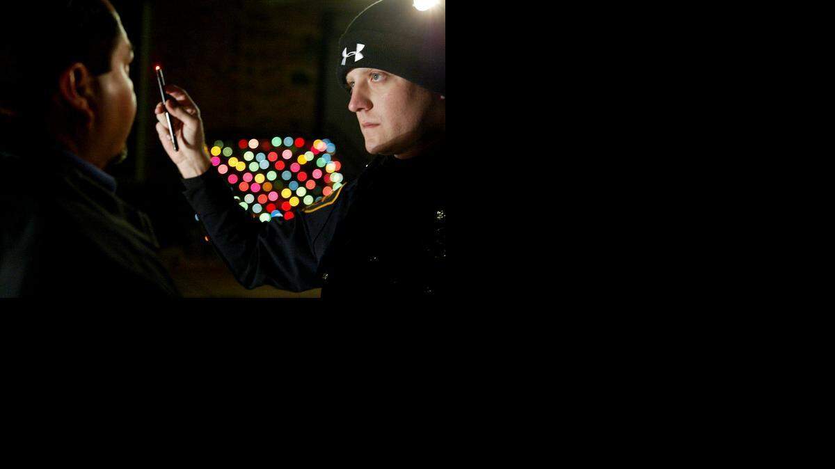 
Fort Worth police officer Collin Harris looks for signs of drunken driving in this Star-Telegram archive photo. 
