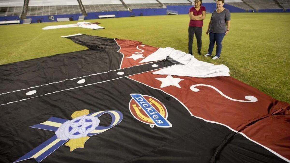 The new clothes for Big Tex include a commemorative patch honoring the Dallas Police Department.