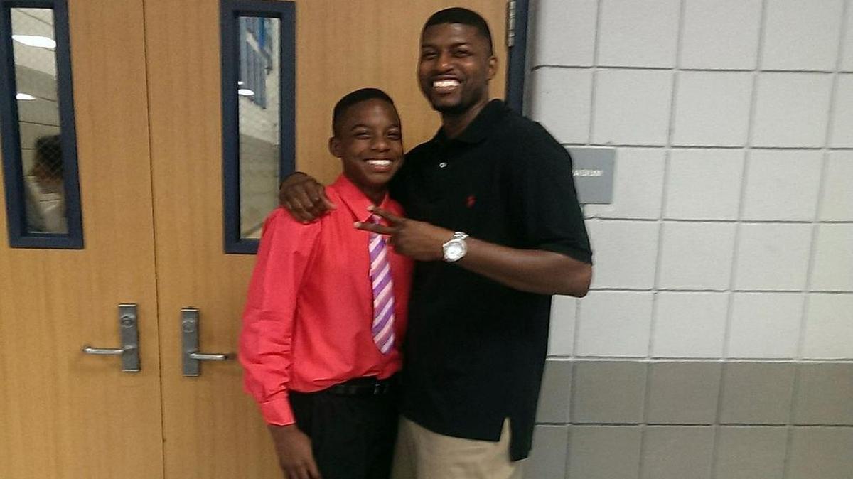 This undated family photo provided by Edwards family attorney Lee Merritt shows Jordan Edwards, left, posing for a photo with his father, Odell Edwards.