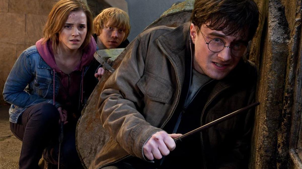 In this film publicity image released by Warner Bros. Pictures, from left, Emma Watson, Rupert Grint and Daniel Radcliffe are shown in a scene from "Harry Potter and the Deathly Hallows: Part 2."