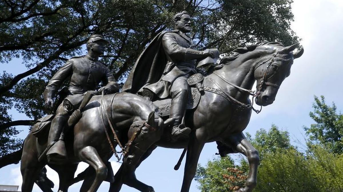 A statue honoring Robert E. Lee, right, with a soldier riding alongside him, in Robert E. Lee Park, a City of Dallas park, is in the Turtle Creek area of Dallas. The four black Dallas city councilmen are calling for the city’s Confederate statues to be removed as way to start healing the city’s racist past. Mayor Pro Tem Dwaine Caraway held a news conference Friday afternoon, Aug. 18, 2017 with the other three black city councilmen to respresent a unified statement on the statues.