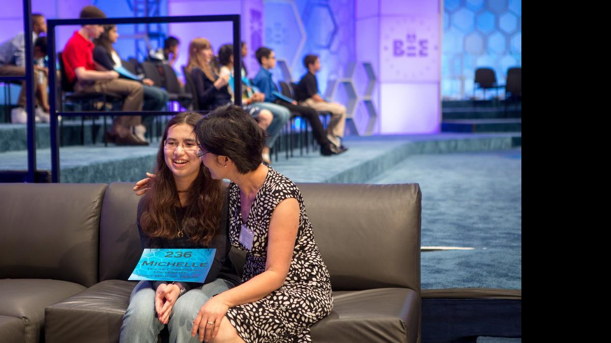 
Michelle Yakubek, 14, an eighth grader at Harmony Science Academy in Euless, is comforted by her mother, Jing Yakubek, after she was eliminated in round six of the semifinals of the 2015 Scripps National Spelling Bee at the Gaylord National Resort and Conference Center in National Harbor, Md.
