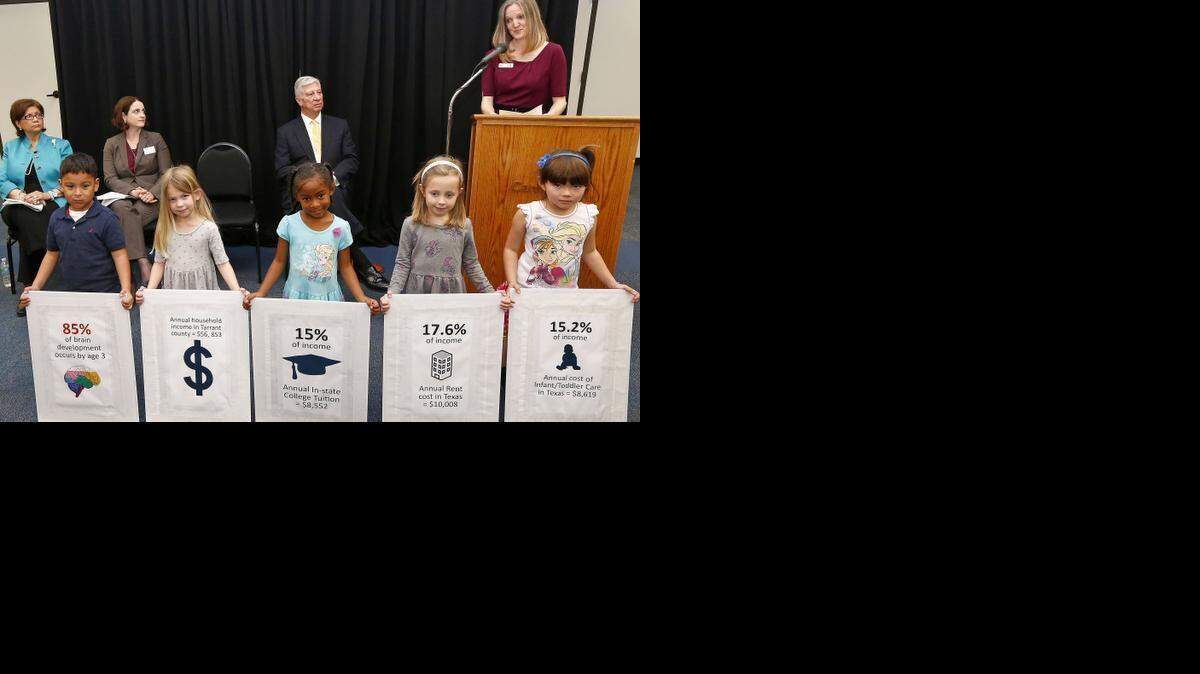 
Lyn Lucas, vice president of development for Camp Fire, speaks at a news conference as pre-K students hold posters showing statistics Tuesday in Fort Worth.
