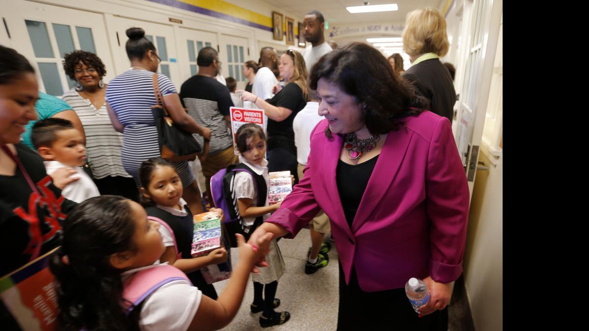 
Interim Superintendent Pat Linares greets parents and students.
