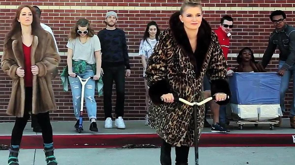 Kelli Hauser, right, stars in the ‘Test Shop’ video.