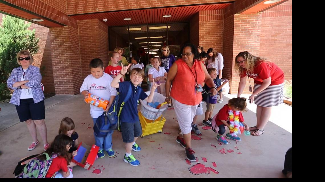 
Center, Owen Roever, who is 10, celebrates his last day of the 2014-2015 school year at Westpark Elementary School.
