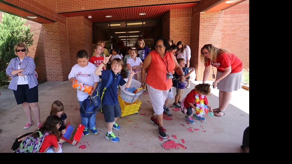 
Center, Owen Roever, who is 10, celebrates his last day of the 2014-2015 school year at Westpark Elementary School.
