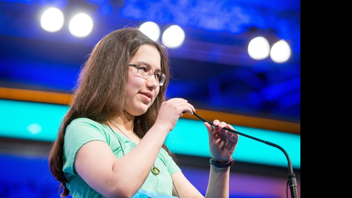 
Michelle Yakubek, an eighth-grader at Harmony Science Academy in Euless, correctly spells "nirvana" in preliminary round two of the 2015 Scripps National Spelling Bee in National Harbor, Md.
