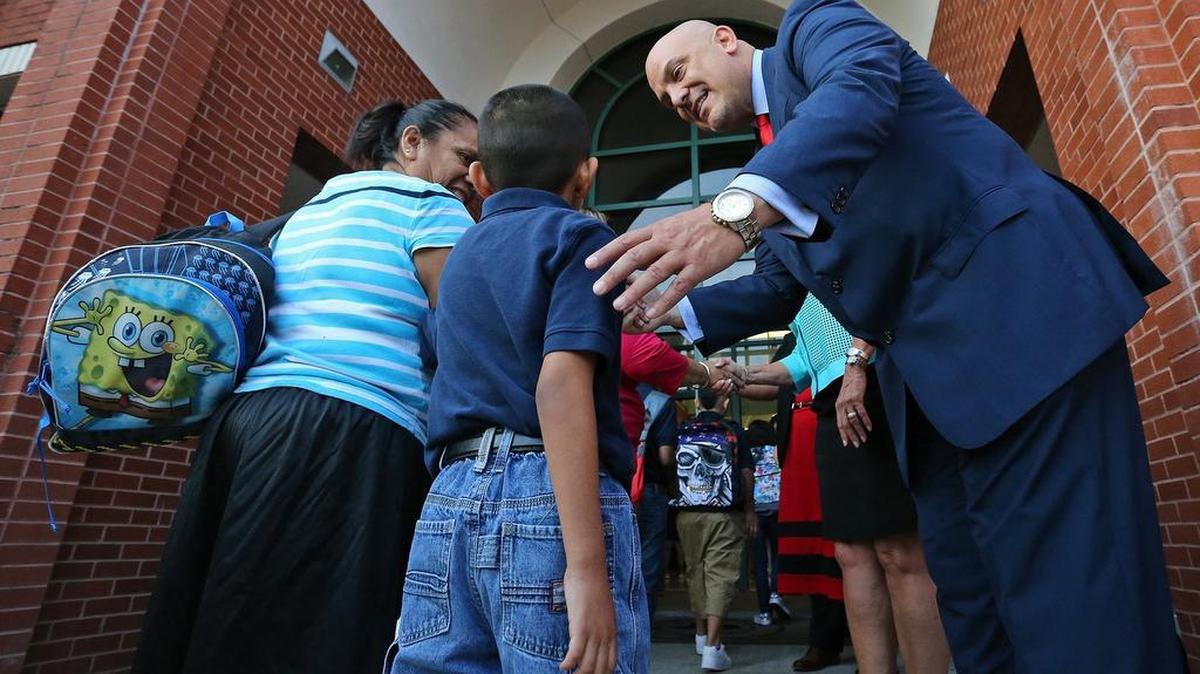 
Incoming Fort Worth Superintendent Dr. Kent Scribner greets parents and students at the front door as school children returned to school at Diamond Hill Elementary.
